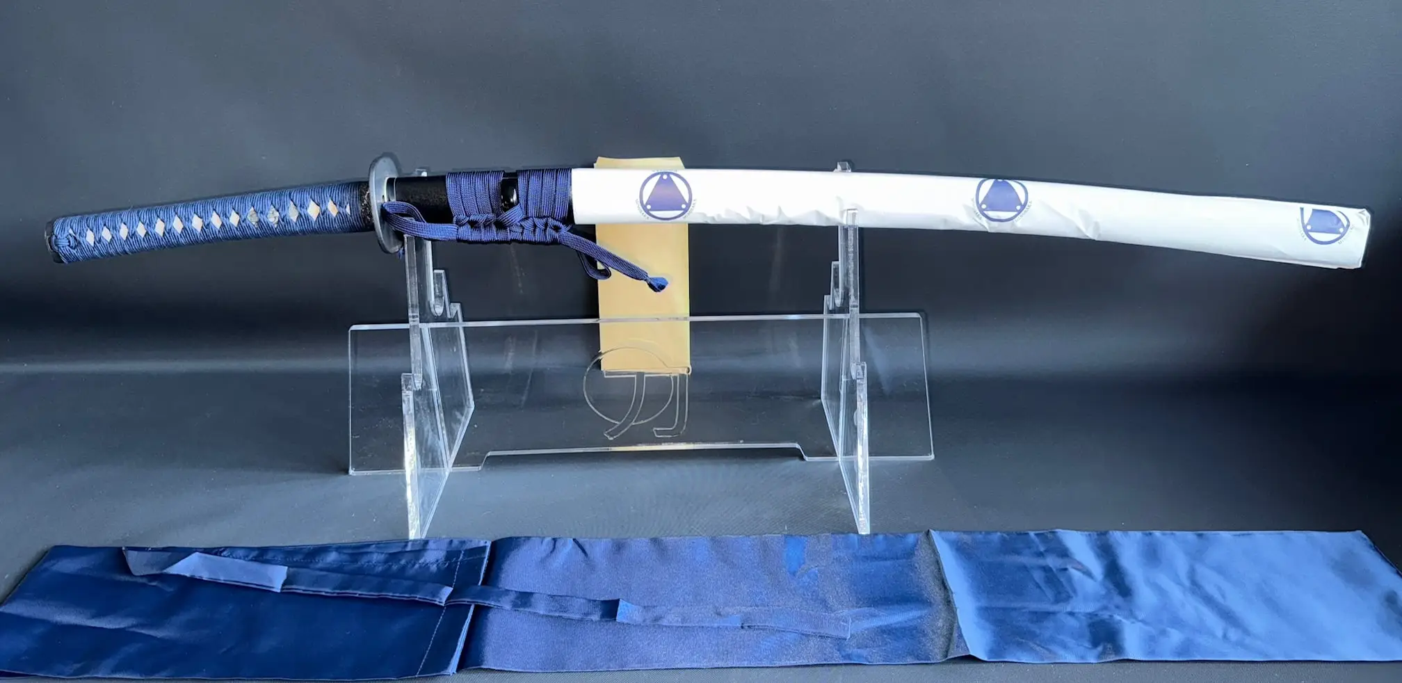 IAITO MINOSAKA TOKUSEI Japanese Iaido sword on display with blue tsuka & white saya, long shot