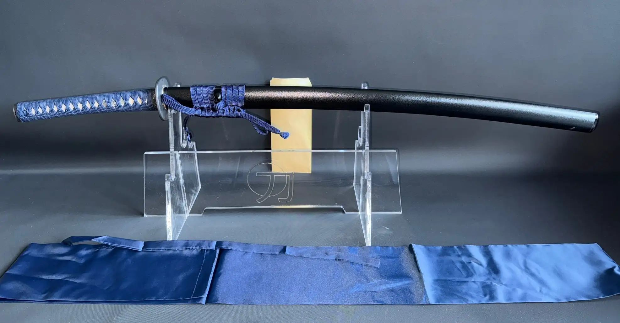 Full length Japanese Iaido sword, the IAITO MINOSAKA TOKUSEI, in its scabbard with blue tsukamaki