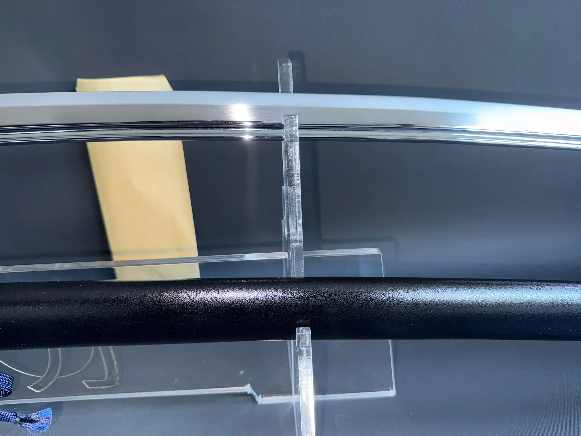 Close-up of a New Handmade IAITO MINOSAKA TOKUSEI Japanese Iaido sword blade and black saya